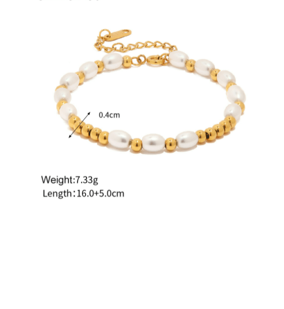 Bracelet with gold and pearl beads on a white background